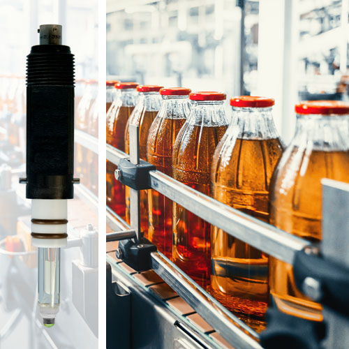juice in glass bottles on an industrial manufacturing production line