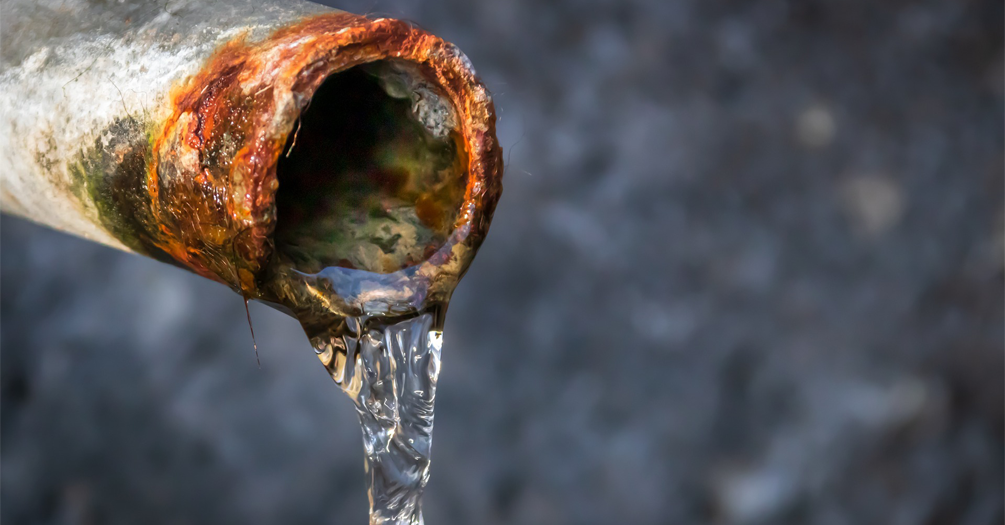 lead pipe with water dripping out