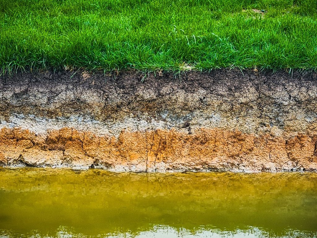 River Bank Gradually Eroding into Surface Water, highlighting soil erosion impact on water quality